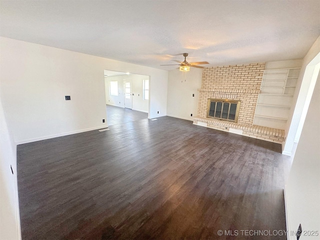 26037 S 520th Rd, Park Hill, OK 74451 - unfurnished living room featuring a ceiling fan, dark wood finished floors, baseboards, and a fireplace