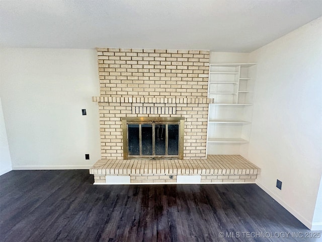 26037 S 520th Rd, Park Hill, OK 74451 - unfurnished living room with wood finished floors, a brick fireplace, baseboards, and built in shelves