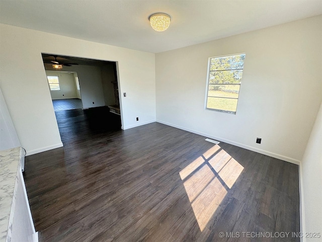 26037 S 520th Rd, Park Hill, OK 74451 - unfurnished room featuring dark wood-style flooring, ceiling fan, and baseboards