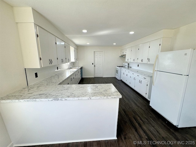 26037 S 520th Rd, Park Hill, OK 74451 - kitchen featuring white appliances, dark wood-type flooring, a peninsula, white cabinets, and recessed lighting