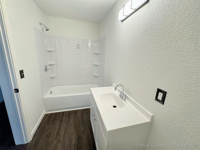 26037 S 520th Rd, Park Hill, OK 74451 - full bathroom featuring a textured wall, wood finished floors, vanity,  shower combination, and baseboards