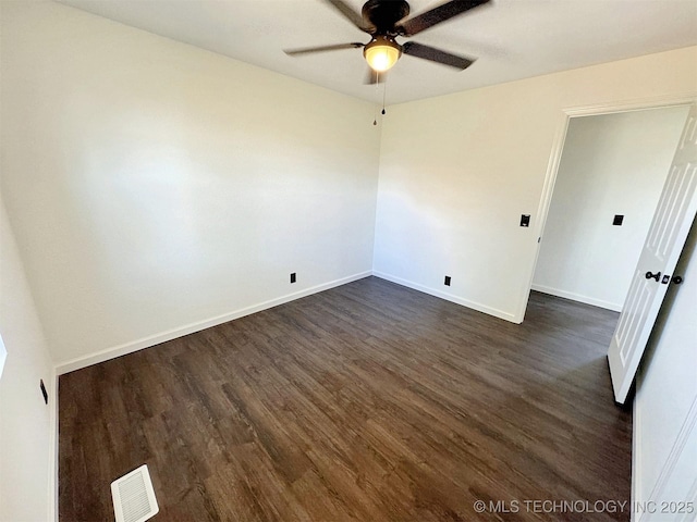26037 S 520th Rd, Park Hill, OK 74451 - spare room featuring ceiling fan, dark wood-type flooring, and baseboards