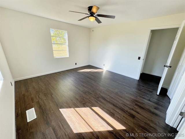 26037 S 520th Rd, Park Hill, OK 74451 - spare room with ceiling fan, dark wood-style flooring, and baseboards