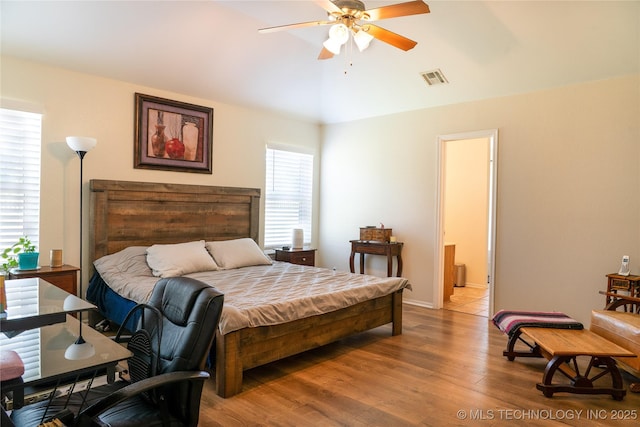7803 N 71st E Ave, Owasso, OK 74055 - bedroom with lofted ceiling, light wood-style floors, and ceiling fan