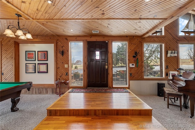 31401 S 620th Rd, Grove, OK 74344 - foyer featuring wooden walls, wood ceiling, a chandelier, pool table, and wood finished floors