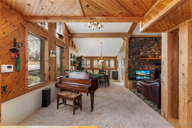 31401 S 620th Rd, Grove, OK 74344 - living area with a chandelier, carpet, wood walls, and a fireplace