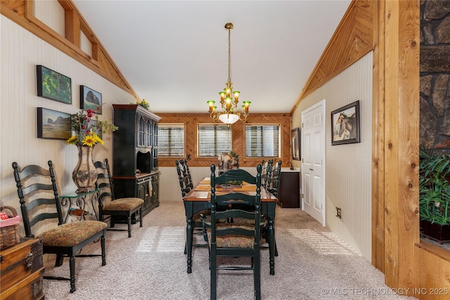 31401 S 620th Rd, Grove, OK 74344 - dining area featuring vaulted ceiling, light carpet, wood walls, and a chandelier