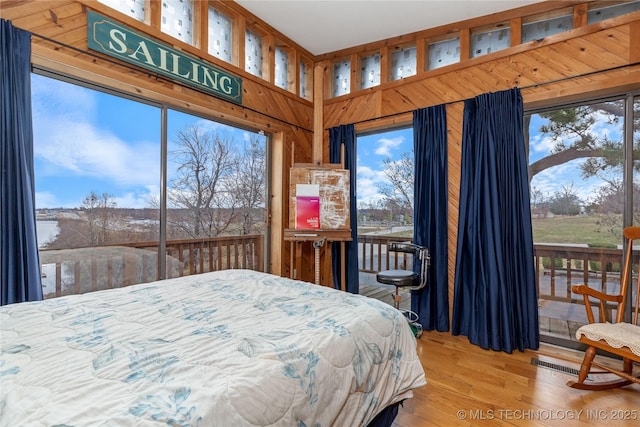 31401 S 620th Rd, Grove, OK 74344 - bedroom with access to outside and wood finished floors