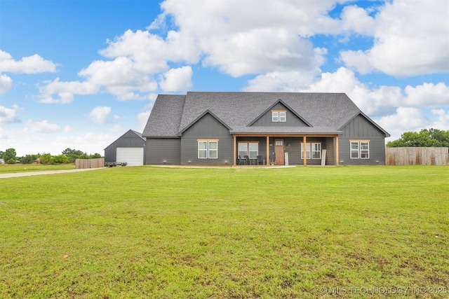 114 Wilson Loop, Durant, OK 74701 - view of front of property featuring board and batten siding, a detached garage, driveway, and a shingled roof