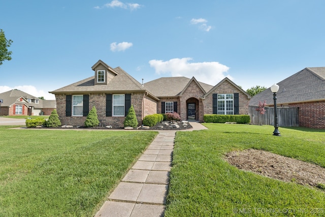 14201 E 101st St, Owasso, OK 74055 - view of front of house with brick siding and roof with shingles