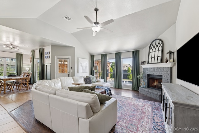 14201 E 101st St, Owasso, OK 74055 - living area with lofted ceiling, ceiling fan, and a brick fireplace