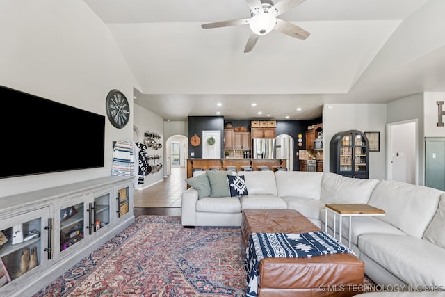 14201 E 101st St, Owasso, OK 74055 - living area featuring vaulted ceiling, arched walkways, ceiling fan, and recessed lighting