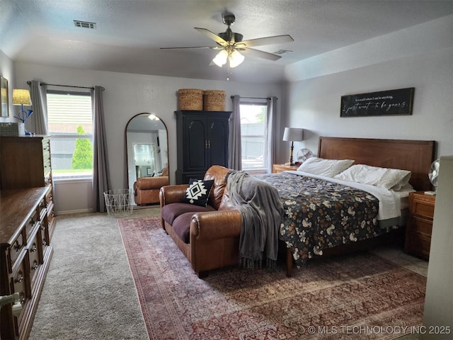 14201 E 101st St, Owasso, OK 74055 - bedroom with carpet floors, ceiling fan, baseboards, and a textured ceiling