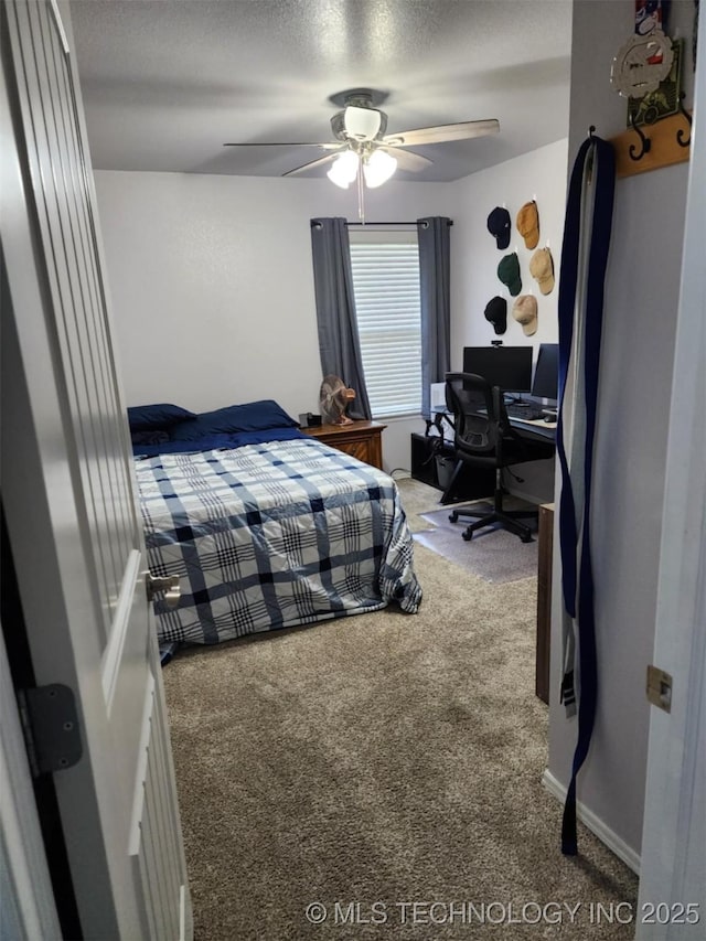 14201 E 101st St, Owasso, OK 74055 - bedroom with carpet, a desk, ceiling fan, and a textured ceiling