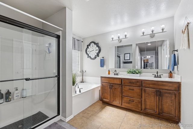 14201 E 101st St, Owasso, OK 74055 - full bath featuring a stall shower, double vanity, a bath, tile patterned flooring, and a textured ceiling