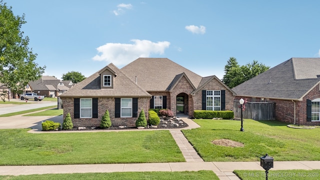 14201 E 101st St, Owasso, OK 74055 - view of front of property with brick siding and roof with shingles
