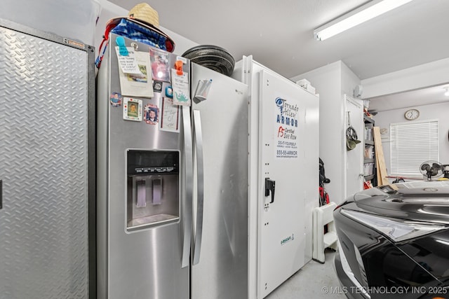 14201 E 101st St, Owasso, OK 74055 - kitchen featuring stainless steel refrigerator with ice dispenser and concrete flooring