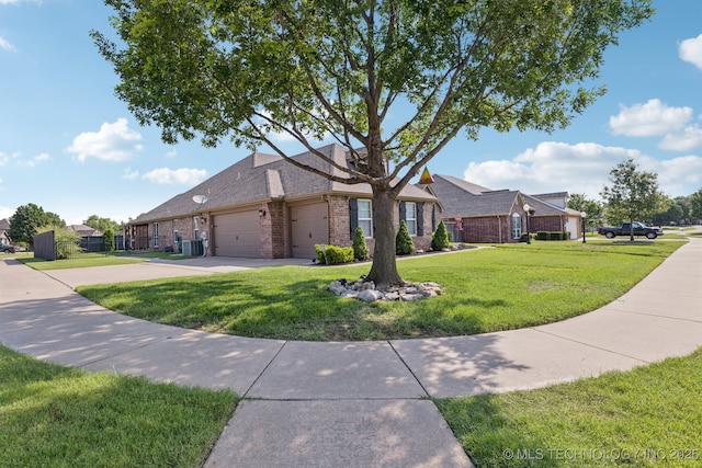 14201 E 101st St, Owasso, OK 74055 - view of front facade with brick siding, a garage, driveway, and a front lawn