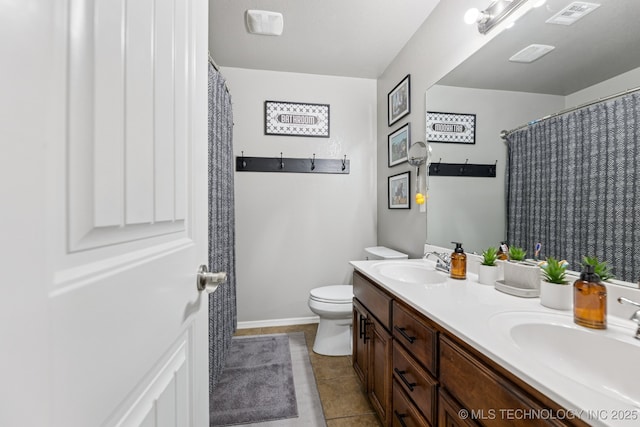 14201 E 101st St, Owasso, OK 74055 - full bathroom featuring double vanity, toilet, tile patterned flooring, baseboards, and curtained shower