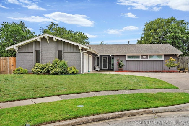7630 E 54th Pl, Tulsa, OK 74145 - view of front of home with brick siding, driveway, an attached garage, and board and batten siding