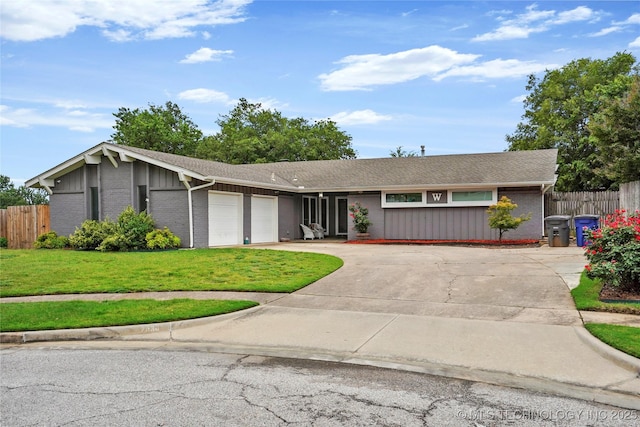 7630 E 54th Pl, Tulsa, OK 74145 - view of front of property featuring an attached garage, brick siding, and driveway