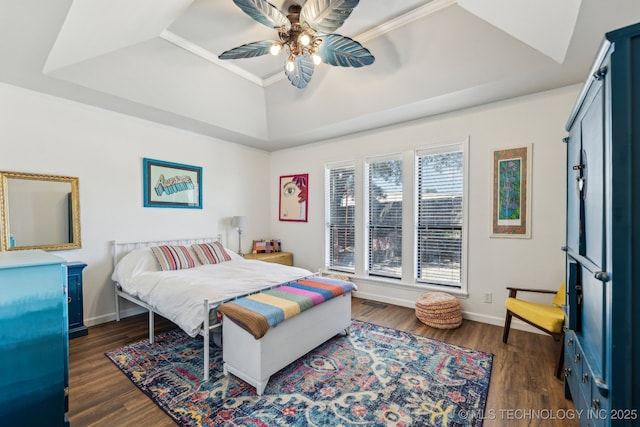 6717 E 99th St, Tulsa, OK 74133 - bedroom featuring a raised ceiling, dark wood-style floors, ceiling fan, crown molding, and baseboards