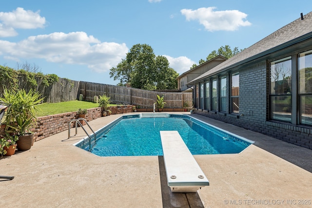 6717 E 99th St, Tulsa, OK 74133 - view of pool with a patio area, a diving board, and a fenced backyard