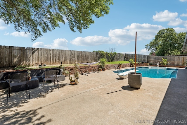 6717 E 99th St, Tulsa, OK 74133 - view of pool with a fenced backyard, a patio area, and outdoor lounge area