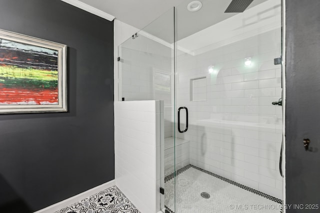 6717 E 99th St, Tulsa, OK 74133 - full bathroom featuring a stall shower, crown molding, baseboards, and tile patterned floors