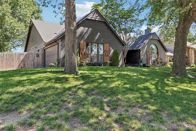 6717 E 99th St, Tulsa, OK 74133 - view of front of house featuring brick siding and an attached garage