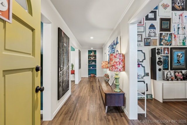 6717 E 99th St, Tulsa, OK 74133 - hall featuring wood finished floors, baseboards, crown molding, built in shelves, and recessed lighting