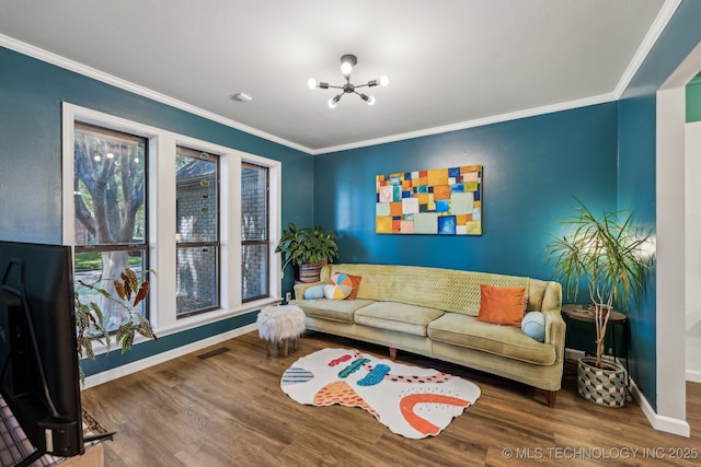 6717 E 99th St, Tulsa, OK 74133 - living area with a chandelier, baseboards, wood finished floors, and crown molding