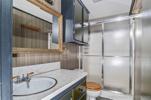 2728 E 13th Pl, Tulsa, OK 74104 - bathroom featuring vanity, a shower stall, and toilet