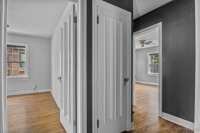 2728 E 13th Pl, Tulsa, OK 74104 - corridor featuring light wood-style floors and baseboards