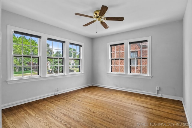 2728 E 13th Pl, Tulsa, OK 74104 - spare room with light wood-type flooring, baseboards, and ceiling fan