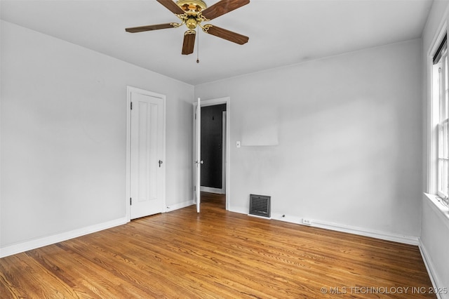 2728 E 13th Pl, Tulsa, OK 74104 - spare room featuring light wood-type flooring, ceiling fan, and baseboards