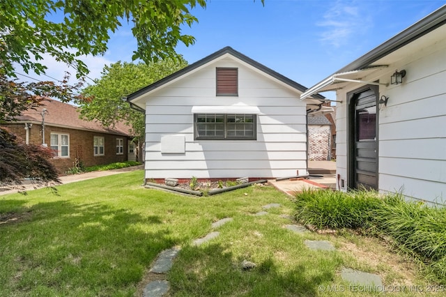 2728 E 13th Pl, Tulsa, OK 74104 - back of house featuring a yard