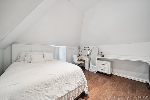 9914 S Garnett Rd, Broken Arrow, OK 74012 - bedroom featuring lofted ceiling and wood finished floors