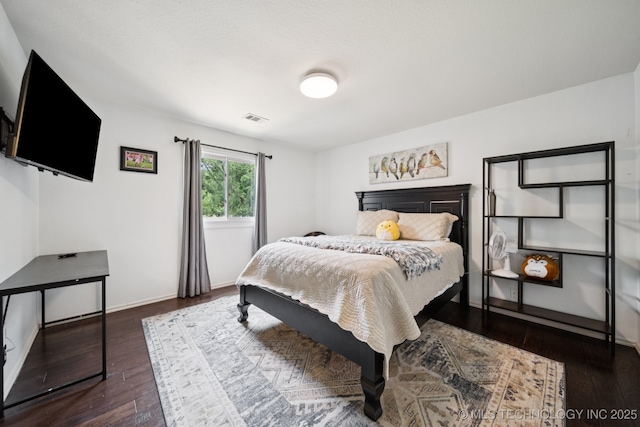 9914 S Garnett Rd, Broken Arrow, OK 74012 - bedroom featuring dark wood finished floors