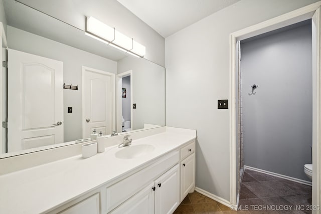 9914 S Garnett Rd, Broken Arrow, OK 74012 - full bath featuring toilet, vanity, and baseboards