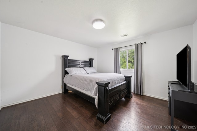 9914 S Garnett Rd, Broken Arrow, OK 74012 - bedroom with dark wood finished floors and baseboards