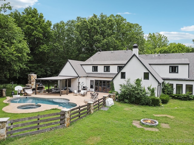 9914 S Garnett Rd, Broken Arrow, OK 74012 - rear view of house featuring an outdoor living space with a fire pit, a patio, stucco siding, a chimney, and roof with shingles