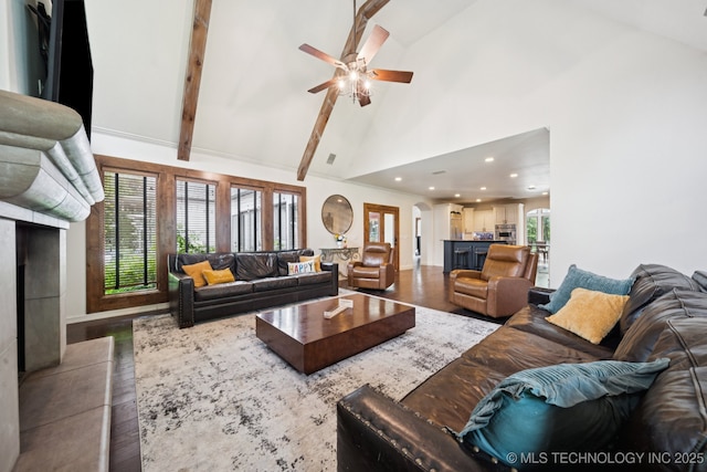 9914 S Garnett Rd, Broken Arrow, OK 74012 - living room with arched walkways, wood finished floors, high vaulted ceiling, a ceiling fan, and recessed lighting