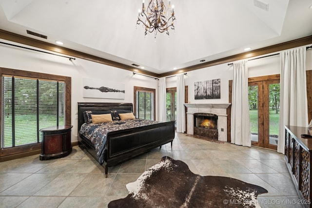 9914 S Garnett Rd, Broken Arrow, OK 74012 - bedroom featuring a chandelier, a lit fireplace, access to exterior, recessed lighting, and tile patterned floors