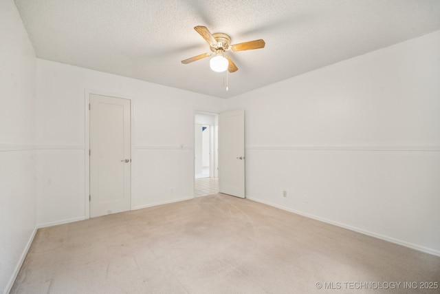 8216 S Oswego Ave, Tulsa, OK 74137 - unfurnished room featuring a ceiling fan, light carpet, baseboards, and a textured ceiling