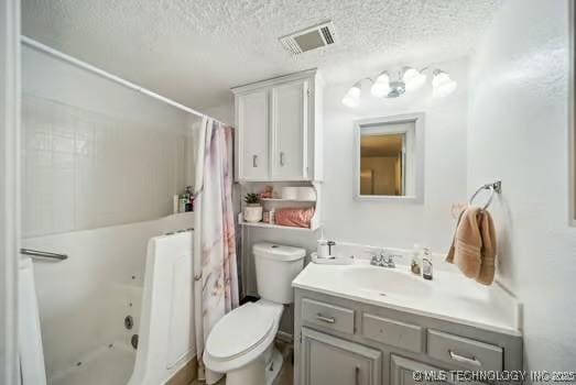 7450 N 117th E Ave, Owasso, OK 74055 - full bathroom featuring vanity, toilet, a textured ceiling, and shower / bath combo