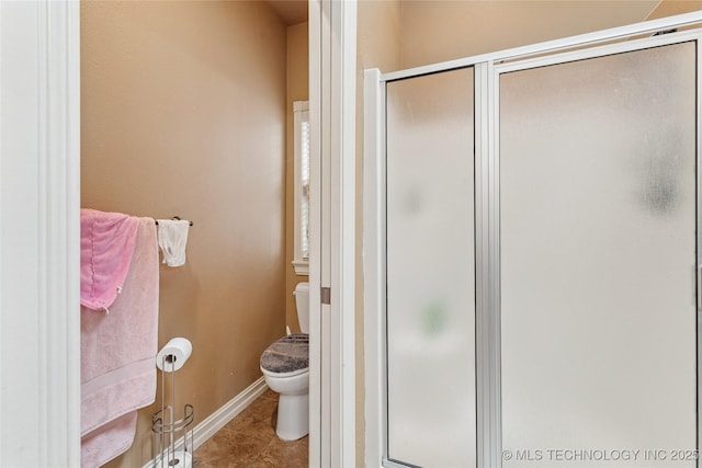 2508 S 14th St, Mcalester, OK 74501 - full bathroom featuring toilet, a stall shower, tile patterned flooring, and baseboards