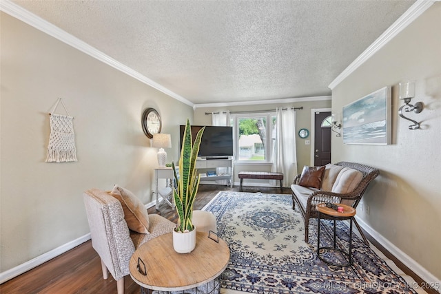 3508 E 30th St, Tulsa, OK 74114 - living room with baseboards, wood finished floors, a textured ceiling, and ornamental molding