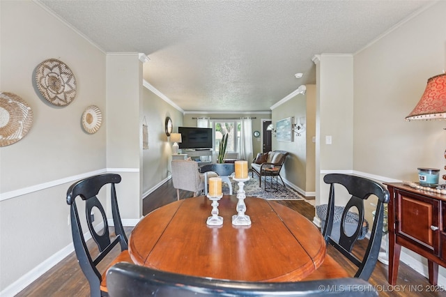 3508 E 30th St, Tulsa, OK 74114 - dining space featuring wood finished floors, a textured ceiling, crown molding, and baseboards