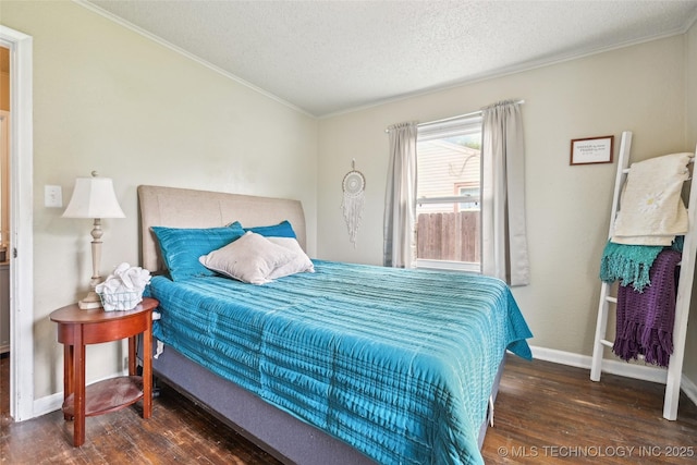 3508 E 30th St, Tulsa, OK 74114 - bedroom with wood-type flooring, ornamental molding, a textured ceiling, and baseboards